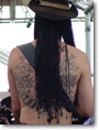 Eric back tattoo and braids