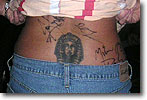 An unidentified fan's back with all three autographs